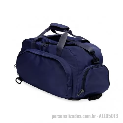 Bolsa de academia personalizada -  Bolsa esportiva de 32 litros em poliéster resistente à água com cinco compartimentos, sendo três deles exclusivos para tênis, itens molhados e armazenamento das alças de costas . Com alça transversal removível e alça de mãos com suporte de juntura, a bolsa contém alças para as costas ocultas no compartimento inferior, podendo ser transportada como mochila.