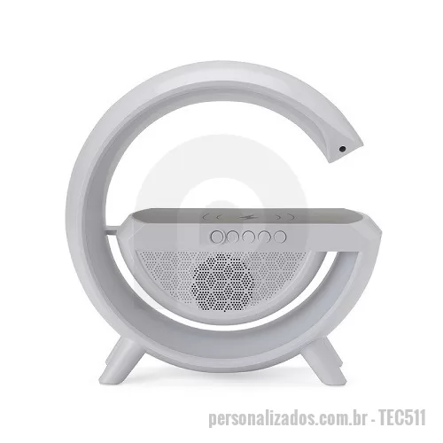 Caixa de Som com Bluetooth personalizada - Caixa de som com carregador por indução e luminária. Possui 6 modos de iluminação, opera nos modos bluetooth, rádio FM, auxiliar P2, USB e TF (cartão MicroSD). Para desfrutar do carregamento por indução (sem fio) é fundamental que o celular possua a tecnologia QI, o produto só armazena bateria para funcionamento próprio, para funcionar a indução precisa estar conectado a uma fonte de energia.