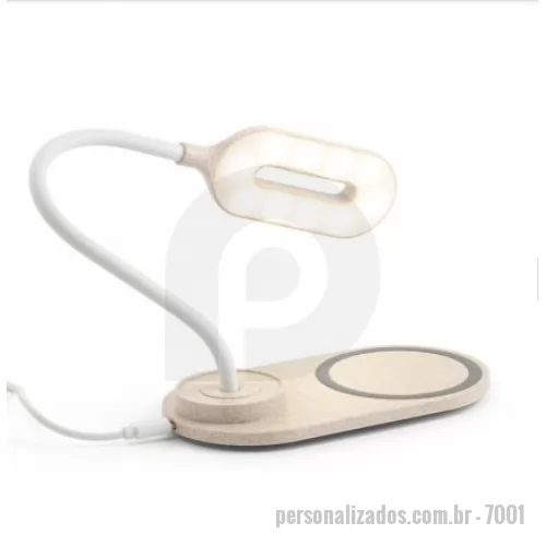 Carregador de celular personalizado - Luminária de mesa em fibra de palha de trigo e ABS com carregador por indução (wireless) super-rápido. A haste é flexível para ajustar a direção da luz e contém 20 LEDs que permitem uma iluminação até 3 níveis de intensidade. No topo da luminária encontra-se um botão touch para ligar, desligar e ajustar os níveis de iluminação. O carregador sem fios é de carregamento super-rápido, tendo uma potência até 15W. No local onde o equipamento é colocado tem um círculo com silicone para evitar que se mova. Incluso cabo USB-C de 1 m. Fornecido em caixa presente de papel kraft reciclado. A cor e o resultado da impressão nos materiais naturais pode variar entre produtos. 160 x 268 x 85 mm