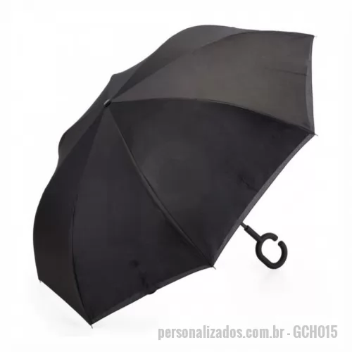 Guarda chuva personalizada - Guarda-chuva invertido com forro interno. Tecido de nylon impermeável preto, possui um mecanismo inovador permitindo que o usuário não se molhe ao entrar e sair de ambientes devido sua abertura invertida, quando feito o movimento para fechar as varetas inverterão para cima criando um formato circular impedindo a chuva de atingir o usuário, podendo “segurar” a chuva enquanto entra/sai de um ambiente e depois virando o guarda-chuva irá escorrer a água. Forro interno para preservação das 8 varetas, evitando contato com a água e assim prolongando seu tempo de uso sem enferrujar. Ao impulsionar o fechamento invertido fica mais rápido e prático o modo de secar e ser guardado, pode ser apoiado no chão que permanecerá em pé para escorrer a água. Pegador plástico fosco em formato C, botão acionador vermelho e fita com velcro(contorno marrom) para lacre. Tamanho total aproximado: Fechado: 79,5 cm x 9,4 cm – Aberto:  ø 106 cm.
