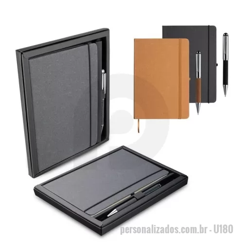 Kit escritório personalizado - Kit caderno de anotações e caneta. O kit acompanha a caneta, e sua embalagem é apresentável. O caderno de anotações é feito de material reciclável que imita a representação do couro, em capa dura com miolo 80 folhas pautadas na cor bege. Gravação da logomarca em 1 cor já inclusa.
