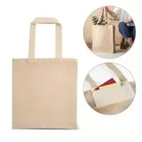 Sacola em juco (275 g/m²) com bolso interior 100% algodão (120 g/m²) com fecho e alças de 60 cm. Pegas em webbing de algodão bicolor. 