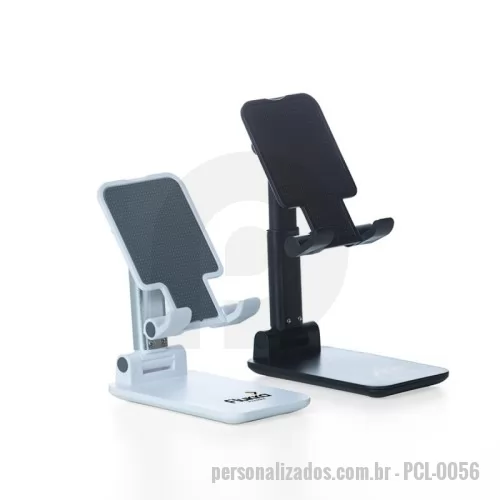 Suporte para celular personalizado - Suporte retrátil para celulares e tablets. Produzido em plástico com haste de alumínio, o suporte possui ângulo ajustável e extensão de altura. Seu tapete de silicone antiderrapante garante a estabilidade do eletrônico sem machucar sua traseira. As “canaletas” também revestidas de silicone encaixam perfeitamente ao eletrônico sem bloquear a visualização da tela, além do espaçamento ideal que permite o carregamento do celular/tablet no suporte sem bloquear a visão ou atrapalhar sua estadia. Com base de silicone antiderrapante, o suporte permanece fixo e estável nas mais diversas superfícies.