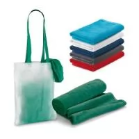 Toalha de praia em veludo de algodão (320 g/m²), disponível em várias cores. Fornecida com sacola em non-woven (80 g/m²). 1500 x 750 mm | Sacola: 330 x 415 x 100 mm